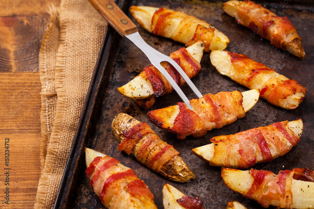 Bacon Wrapped Potatoes Wedges. Selective focus.