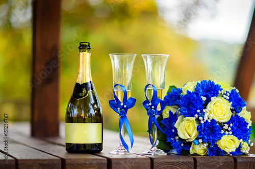 Champagne ,wineglasses and a bouquet