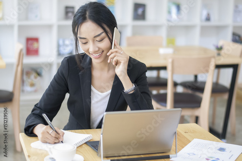 A business woman working on the laptop at the office