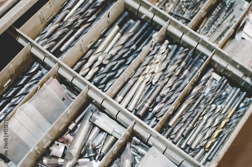 High angle view of drill bits in toolbox photo