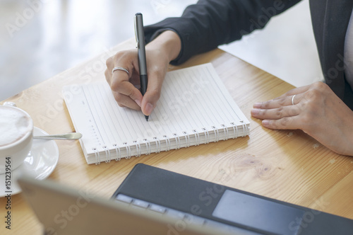 Business documents on office table with smart phone and digital tablet and graph financial.