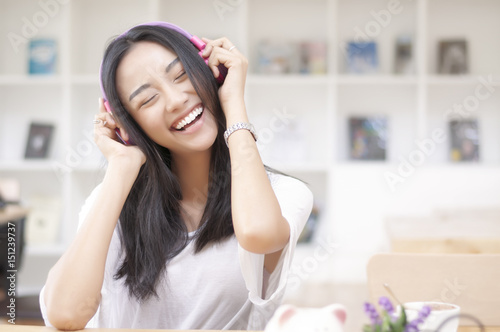 young beautiful woman listen music