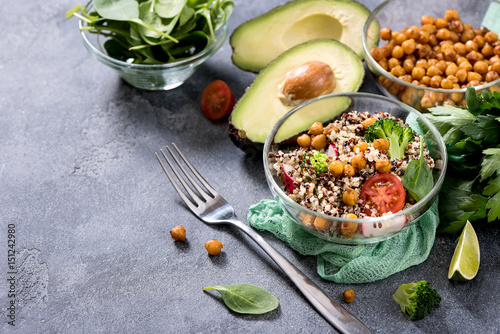 Quinoa salad with chickpeas, spinach, avocado and veggies, healthy vegan food, dieting, clean eating, vitamin and protein snack