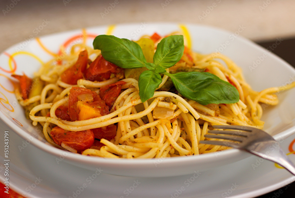 Spaghetti with tomatoes on a plate