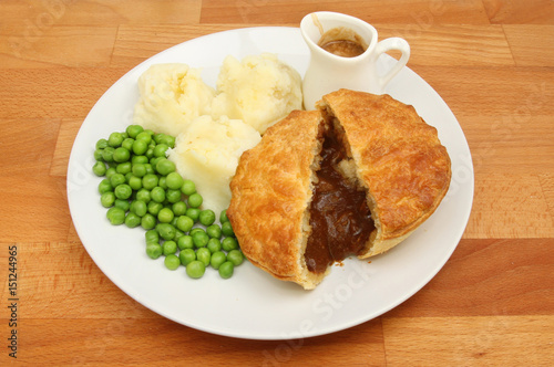 Canvas Print Meat pie and mash on a table