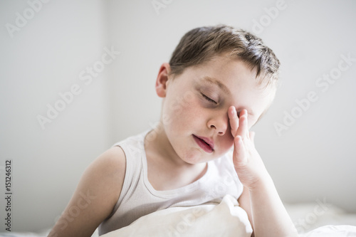 Young Boy on bed photo