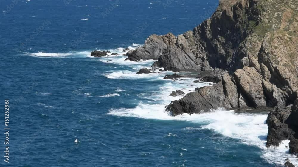 Waves breaking on rocky seashore, Mediterranean coast in the South of France Waves breaking on rocky seashore, Mediterranean coast in the South of France