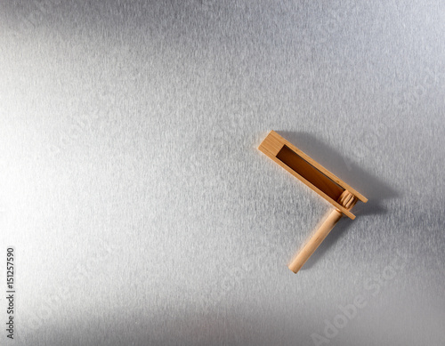 wooden noisemaker or rattle for concept of waking up business