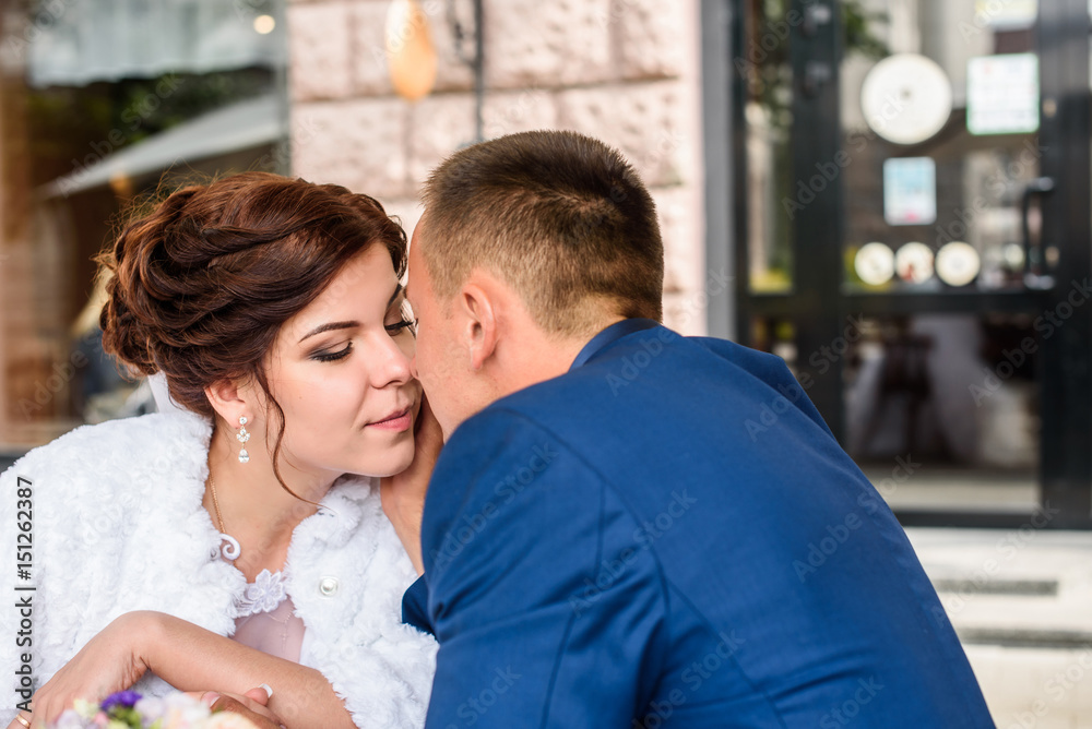 wedding shot of bride and groom kissing wedding shot of bride and groom kissing