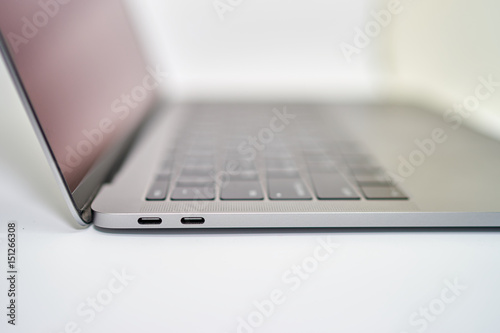 USB type C female connector port at laptop on white background