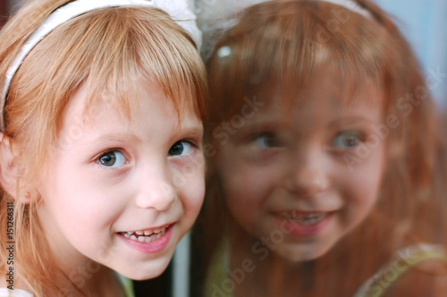 Girl looks at the camera and smiling