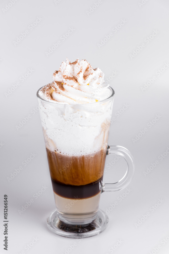 Latte with whipped cream on isolated white background Latte with whipped cream on isolated white background