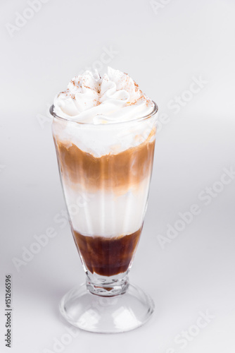 Latte with whipped cream on isolated white background