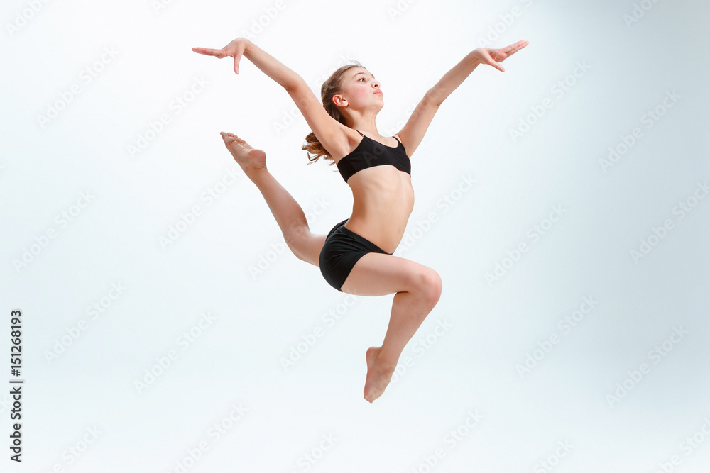 The girl jumping as modern ballet dancer The girl jumping as modern ballet dancer