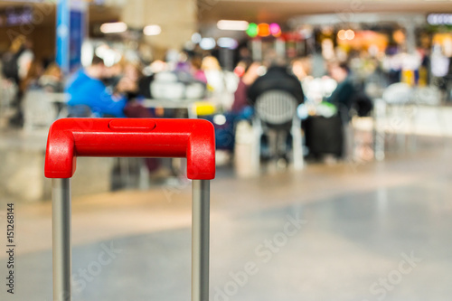 Red suitcase handle close up