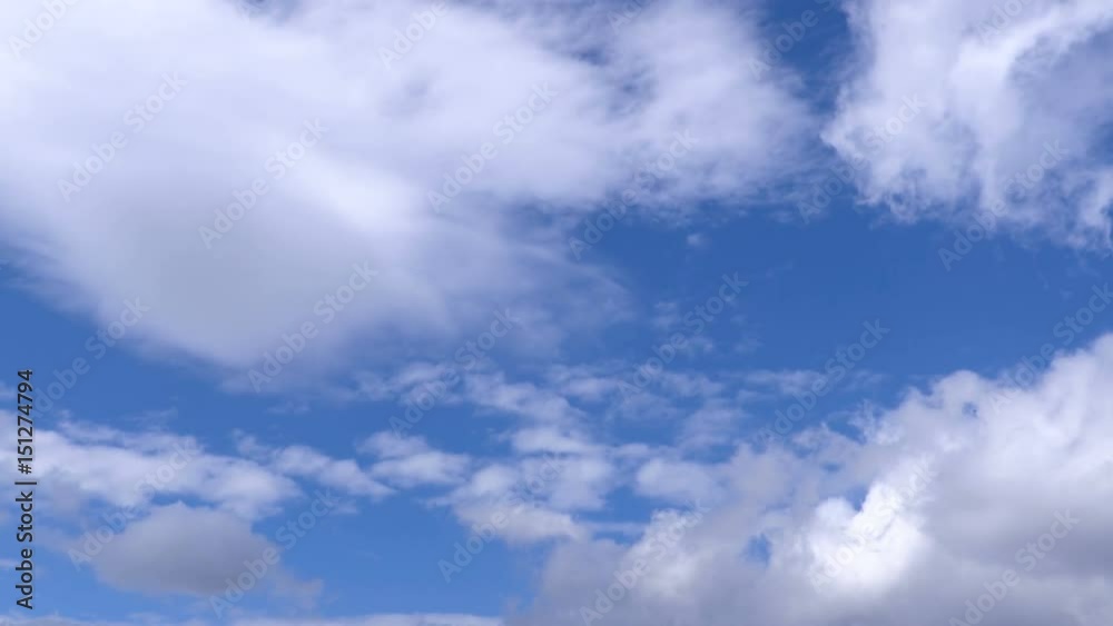 Low clouds are floating on blue sky. Time-lapse recording. 4K, Ultra HD, UHD Low clouds are floating on blue sky. Time-lapse recording. 4K, Ultra HD, UHD