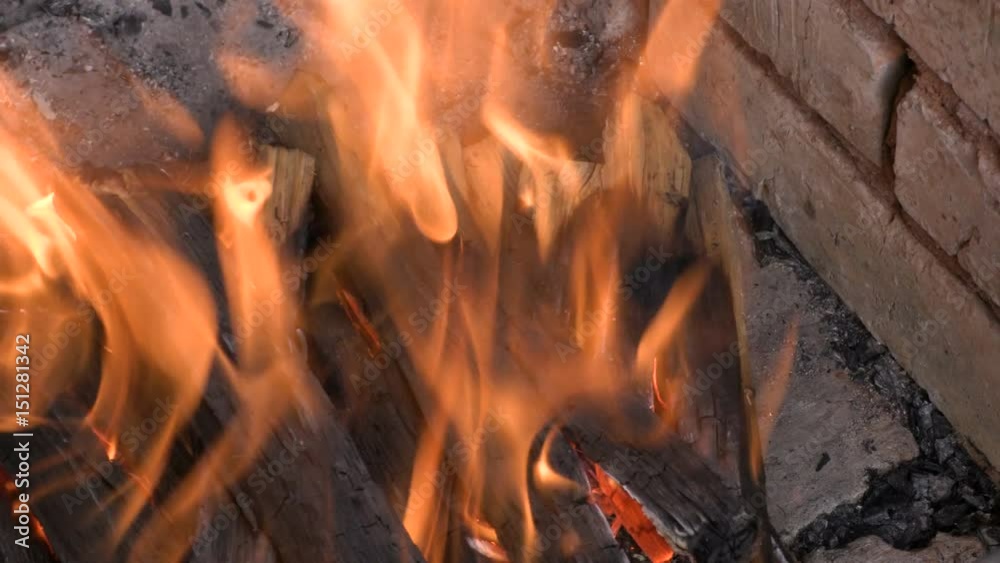 Burning wood in a furnace or fireplace. Clip footage 4K, UHD, Ultra HD Burning wood in a furnace or fireplace. Clip footage 4K, UHD, Ultra HD