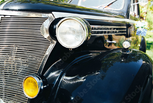 Vintage black wedding car groom at the wedding.