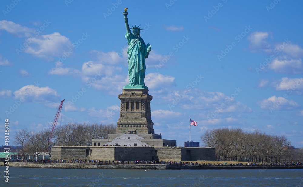 Liberty Island in New York with the famous Statue of Liberty- MANHATTAN / NEW YORK - APRIL 1, 2017