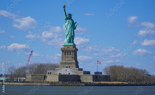 Liberty Island in New York with the famous Statue of Liberty- MANHATTAN / NEW YORK - APRIL 1, 2017 © 4kclips