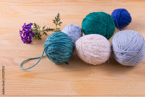 Yarns for knitting on awooden table. photo