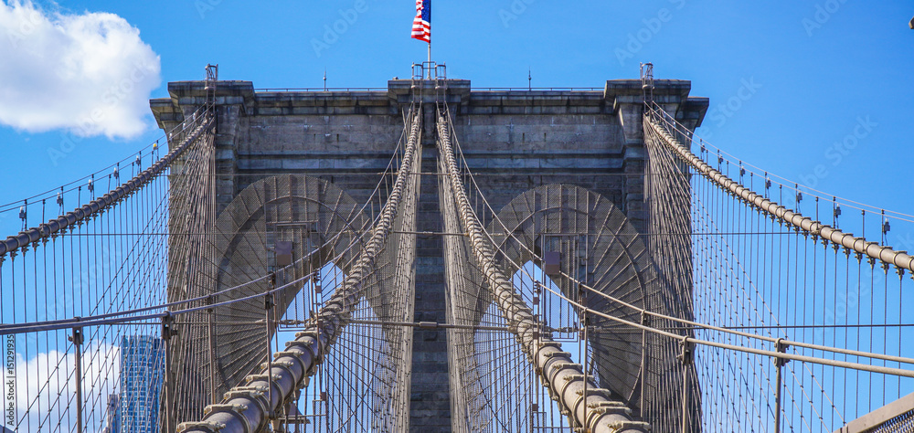 Fototapeta premium Brooklyn Bridge New York - a famous landmark- MANHATTAN / NEW YORK - APRIL 1, 2017