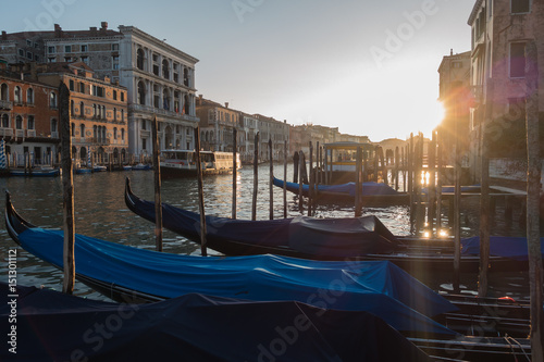 Sunset time over gondolas in Canal Grande, Venice, Italy