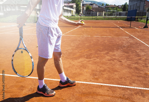 Man playing tennis on the dross © Novak