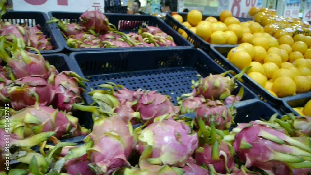 Dragon fruit & oranges at supermarket. Dragon fruit & oranges at supermarket.