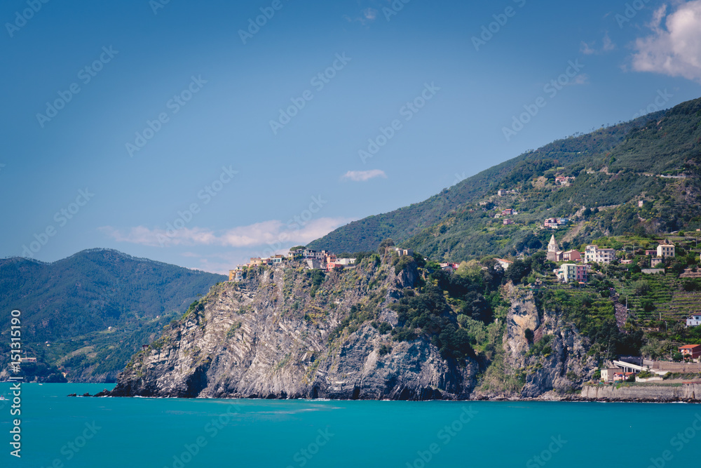 Scenic view of the mediterrean sea and a town inside the Cinque Terre National Park, Liguria, Italy from the cliffs near Manarola.