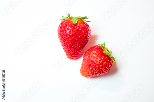 Fototapeta Naklejka Na Ścianę i Meble -  Two berries of strawberries on white background