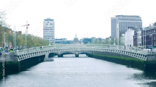 People on Ha'penny Bridge Dublin, Ireland photo