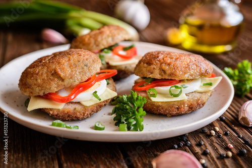 Fried patty filled with cheese, egg, bell pepper and scallion