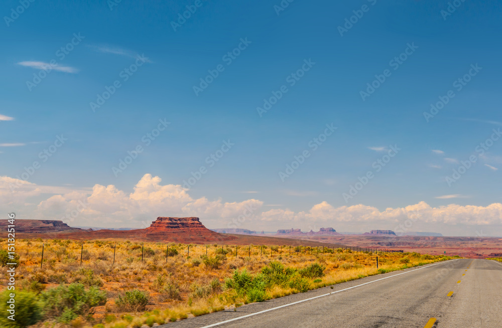 Desert Road winds through Monument Valley in Southwestern USA