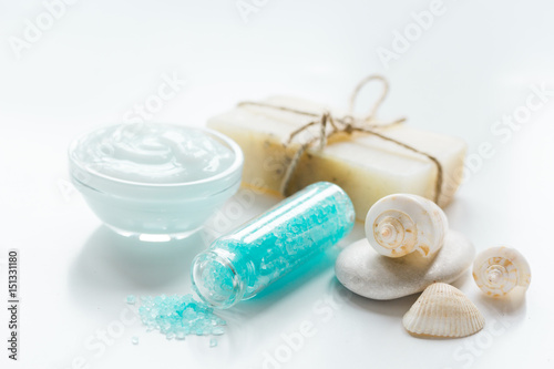 blue sea salt  soap and body cream on white desk background