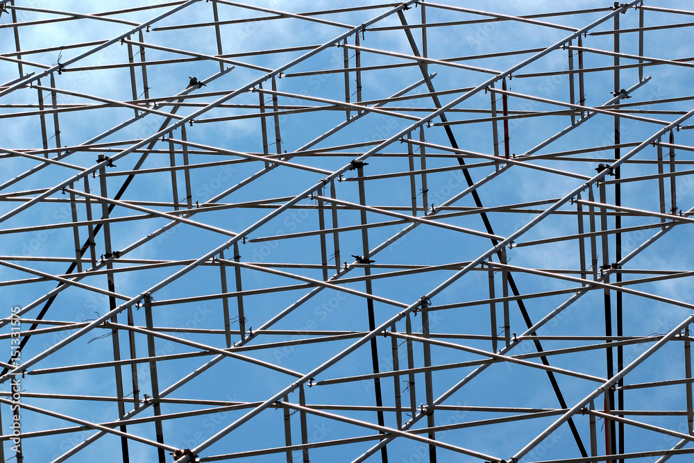 Metal scaffolding against blue sky background Metal scaffolding against blue sky background