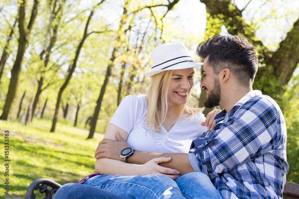 Flirting couple having fun in park on beautiful sunny day Flirting couple having fun in park on beautiful sunny day