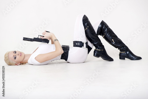 Sexy blonde with a gun photo