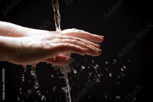 Water falls on the hands