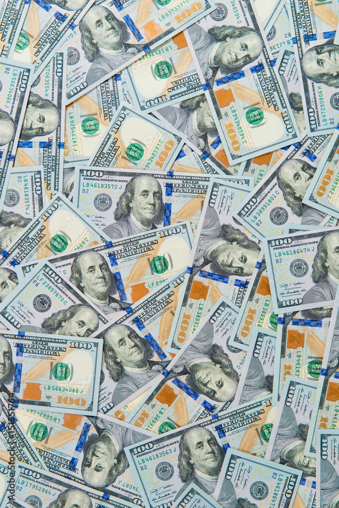 Fototapeta premium Background from scattered dollar banknotes as abstract seamless.