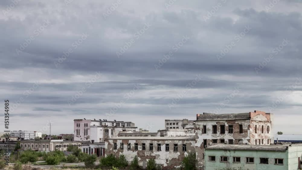 Time lapse of ruined old buildings. Abandoned factory halls with broken glass on windows. Apocalyptic scene with destroyed warehouse. Time lapse of ruined old buildings. Abandoned factory halls with broken glass on windows. Apocalyptic scene with destroyed warehouse.