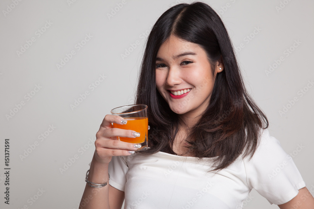 Young Asian woman drink orange juice. Young Asian woman drink orange juice.