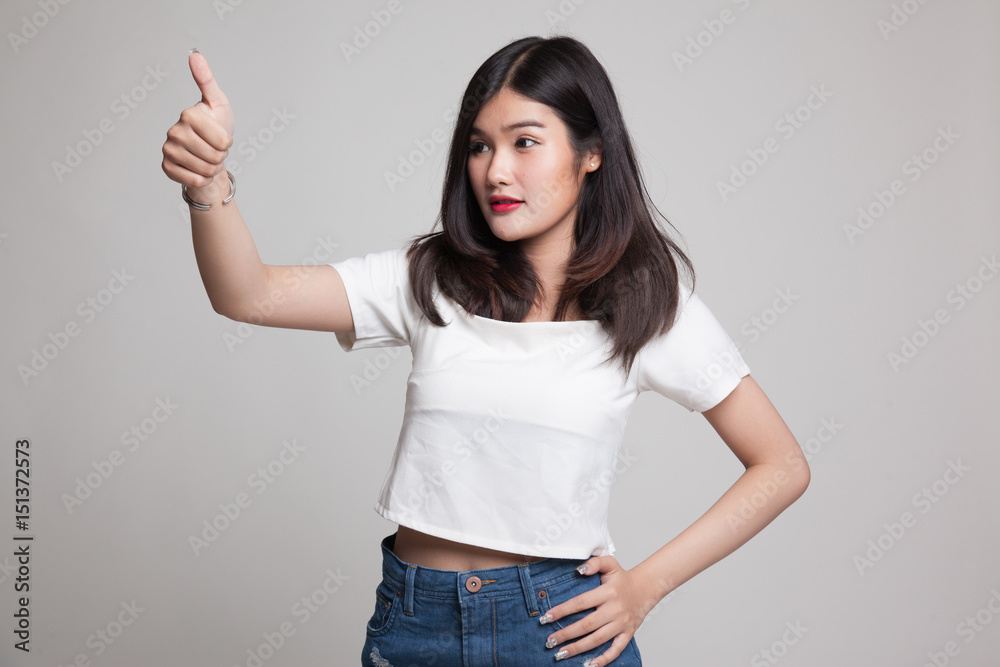 Asian woman thumbs up and smile. Asian woman thumbs up and smile.