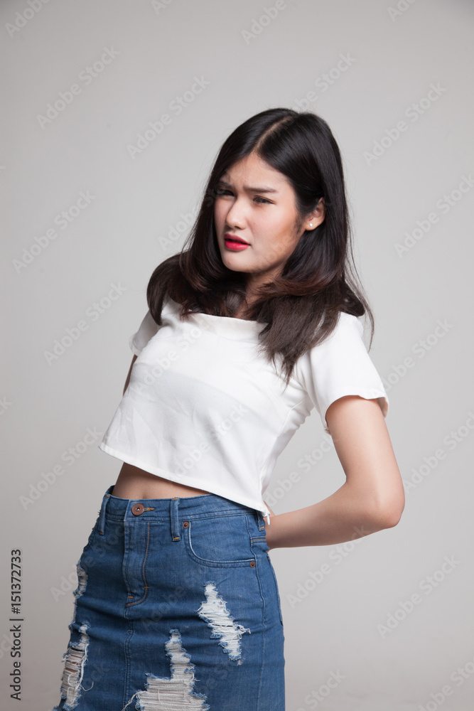 Young Asian woman got back pain. Young Asian woman got back pain.
