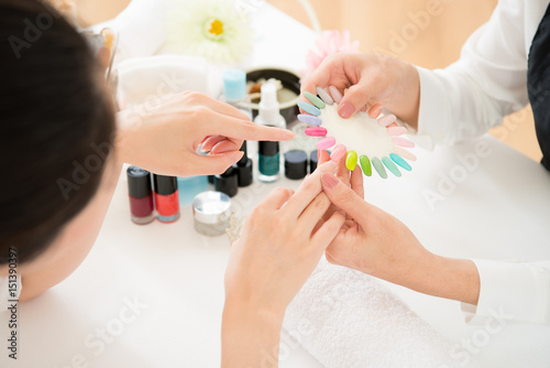 woman selects color shellac nail polish