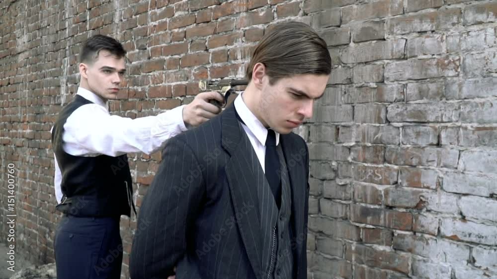 The guy put a gun to the head of another man, slow motion