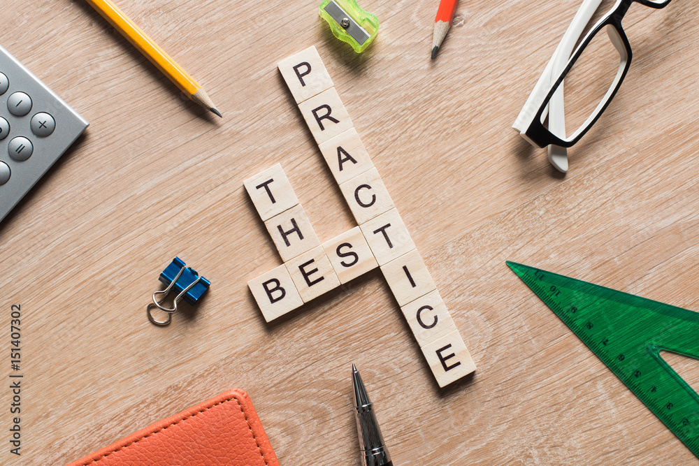 Conceptual keywords on wooden table with elements of game making crossword Conceptual keywords on wooden table with elements of game making crossword