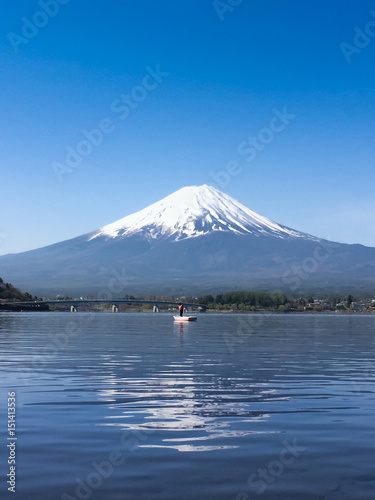 Mountain Fuji reflected in Kawaguchiko lake on a sunny day and clear sky