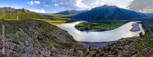 Altai. Mountain turbulent river flows among the trees. In the distance the mountains. Neighborhood Belugas, photo made in the campaign, in the summer, Russia. wide panorama. Panoramic shot around