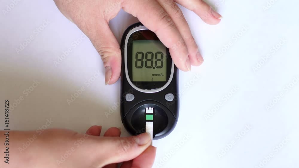Glucometer for measuring glucose level blood close-up on a white background. Medicine, diabetes, glycemia, health care and people concept.